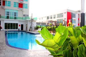 a swimming pool in front of a building at 906 Premier Hotel in Melaka