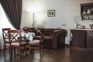 a living room with a couch and a table at Sicheslav Ekaterinoslav in Dnipro