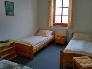 Postel nebo postele na pokoji v ubytování Penzion Bouquet