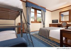 Posteľ alebo postele v izbe v ubytovaní Grand Hotel Trento