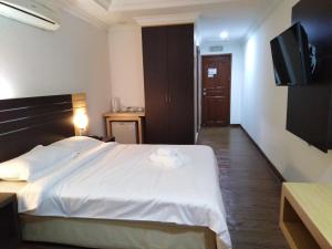 Katil atau katil-katil dalam bilik di Sara Hotel