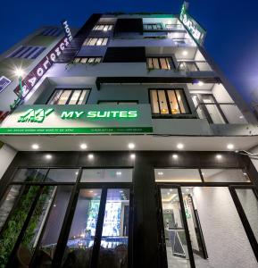 a building with a sign that reads my suites at My Suites Danang Beach in Danang