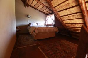 Postel nebo postele na pokoji v ubytování Inyameko BnB