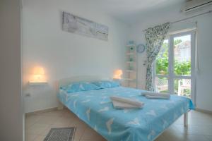 Postel nebo postele na pokoji v ubytování Apartmani Dačo