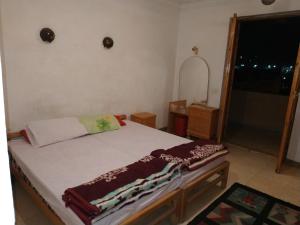 A bed or beds in a room at Adad Noubian House