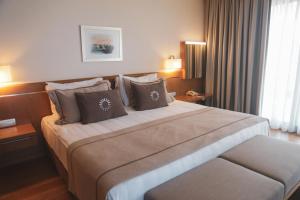 a bedroom with a large bed in a hotel room at ON'LIVE HOTEL in Çeşme