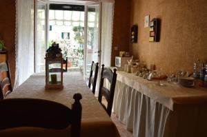 a long table with a white table cloth on it at Villa Gini in Pisa