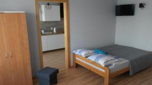 Postel nebo postele na pokoji v ubytování Pokoje Goscinne Bartosz