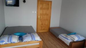 Postel nebo postele na pokoji v ubytování Pokoje Goscinne Bartosz