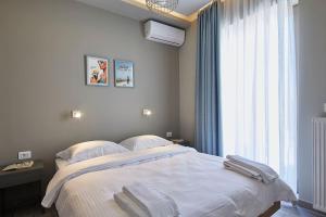 Letto o letti in una camera di Spacious Suite w. huge balcony + Acropolis view