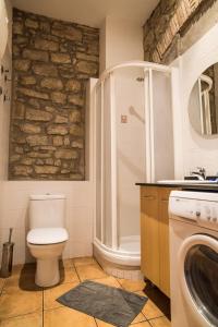 Kúpeľňa v ubytovaní Urbi Apartments + 37 fotografií