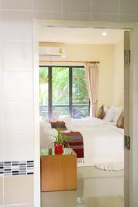Llit o llits en una habitació de ChiangRai Lake Hill