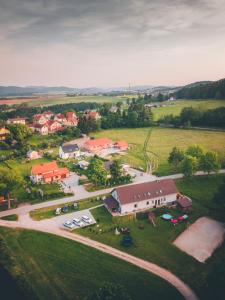 an aerial view of a small village with a house at Penzion Na Podlesí ve Zlaté Koruně in Zlatá Koruna
