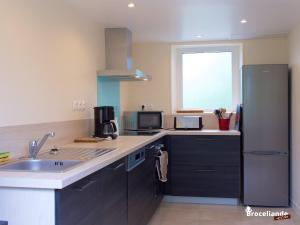 A kitchen or kitchenette at Gite Lancelot du Val