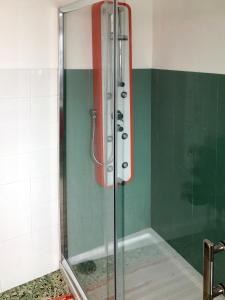 a shower with a glass door in a bathroom at Guest House D'Avenida in Vila Praia de Âncora