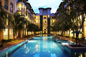 a swimming pool in the middle of a building at Tiara Desaru Resort in Desaru
