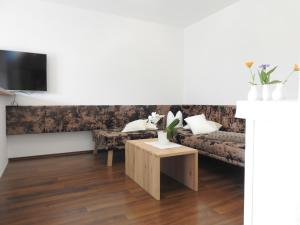 a living room with a couch and a table at Apartment Barbara in Mutters
