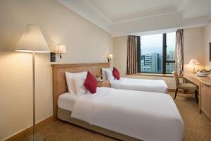 Postelja oz. postelje v sobi nastanitve Ramada Hong Kong Grand View