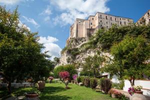 a building on the side of a mountain at Le Roccette Club in Tropea