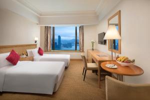 Postelja oz. postelje v sobi nastanitve Ramada Hong Kong Grand View