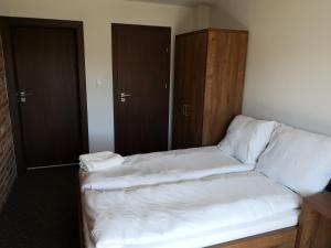 Postel nebo postele na pokoji v ubytování Baltik Park