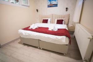Postel nebo postele na pokoji v ubytování T-Square Residence