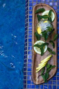 a wooden cutting board with vegetables on a table at Novotel Mohammedia in Mohammedia