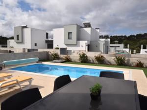 a villa with a swimming pool and a house at Lavish Villa in Foz do Arelho with Private Pool in Foz do Arelho