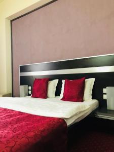 Postel nebo postele na pokoji v ubytování Hotel Angellis