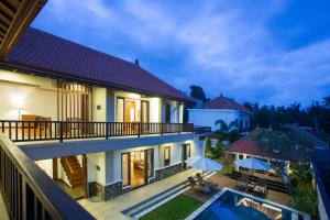 an aerial view of a house with a swimming pool at Villa Sabasanti Gianyar in Keramas