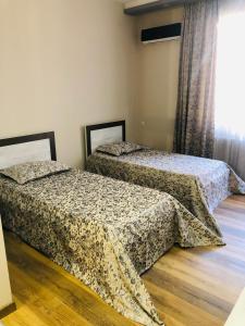 Postel nebo postele na pokoji v ubytování hotel Pharnavaz