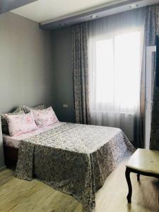 Postel nebo postele na pokoji v ubytování hotel Pharnavaz