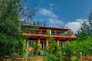 a house in the middle of a forest at SR Jungle Resort in Coimbatore