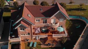 an aerial view of a house with a swimming pool at Gijon Surf Hostel in Gijón