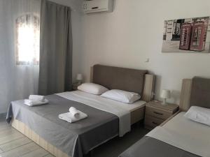 Voodi või voodid majutusasutuse Hotel Riviera toas