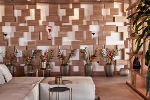 A seating area at Myconian Naia - Preferred Hotels & Resorts