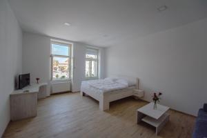 Postel nebo postele na pokoji v ubytování Apartmány Velké náměstí