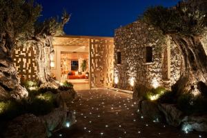 A garden outside Myconian Naia - Preferred Hotels & Resorts