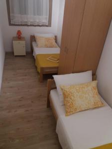 Postel nebo postele na pokoji v ubytování Apartment Nehaj