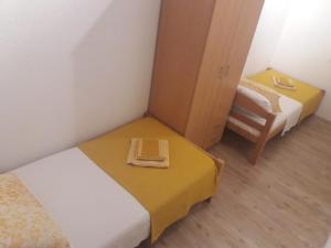 Postel nebo postele na pokoji v ubytování Apartment Nehaj