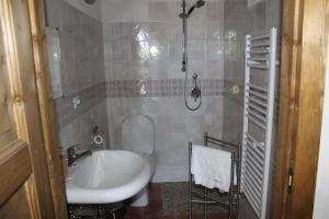 a bathroom with a sink and a toilet and a shower at Agriturismo La Caraffara sull' Etna in Puntalazzo +96 photos