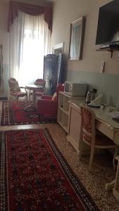 A television and/or entertainment centre at Friendly Venice Suites