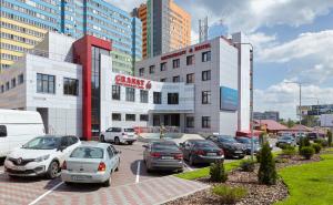 a parking lot full of cars in a city at Granat Hotel in Nizhny Novgorod