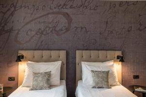 Katil atau katil-katil dalam bilik di Hotel Mrak