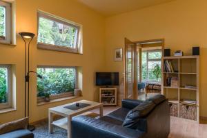 a living room with a couch and a table at Wohnen im Zentrum in Potsdam