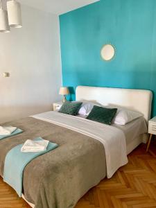 Postel nebo postele na pokoji v ubytování Deluxe Suites Mandić