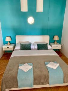 Postel nebo postele na pokoji v ubytování Deluxe Suites Mandić