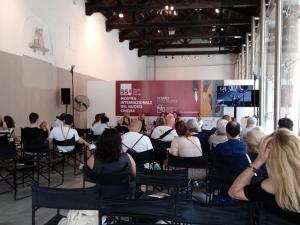 a group of people sitting in chairs in a room at Il Vicolo 48 in Pesaro
