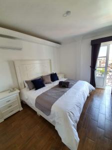 Postel nebo postele na pokoji v ubytování Hotel Estancia Real
