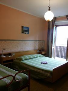 Un pat sau paturi într-o cameră la Albergo la Valle